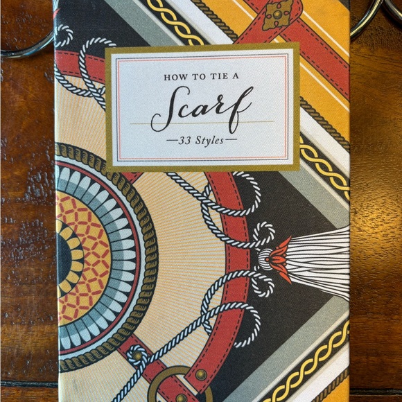 How To Tie A Scarf book with a beautiful scarf and a scarf hanger. - Picture 8 of 11